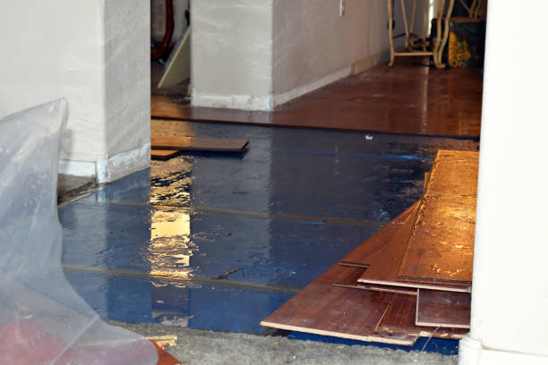 Professional Flood Damage Restoration technician working in Covington, TX